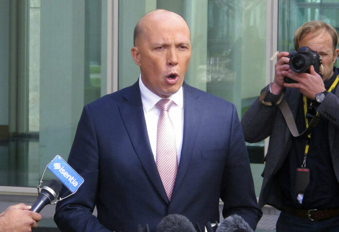 Former Australian Cabinet Minister Peter Dutton addresses the media at Parliament House Tuesday in Canberra, Australia. Photo: Rod McGuirk / Associated Press