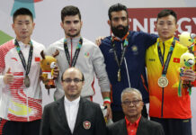 Lutsenko Wins Road Race; China’s Medal Haul Hits 100 From left, silver medalist China's Xueto Wang, gold medalist Iran's Erfan Ahangarian, bronze medalist India's Surya Singh, and bronze medalist Vietnam's Truong Giang Bui during ceremonies at the wushu men's Sanda 60kg division at the 18th Asian Games on Thursday in Jakarta, Indonesia. Photo: Aaron Favila / Associated Press
