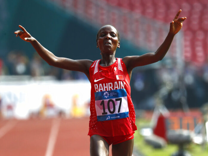 Bahrain's Rose Chelimo crosses the finish line Sunday to win the women's marathon during the athletics competition at the 18th Asian Games in Jakarta, Indonesia. Photo: Bernat Armangue / Associated Press Bahrain's Rose Chelimo crosses the finish line Sunday to win the women's marathon during the athletics competition at the 18th Asian Games in Jakarta, Indonesia. Photo: Bernat Armangue / Associated Press