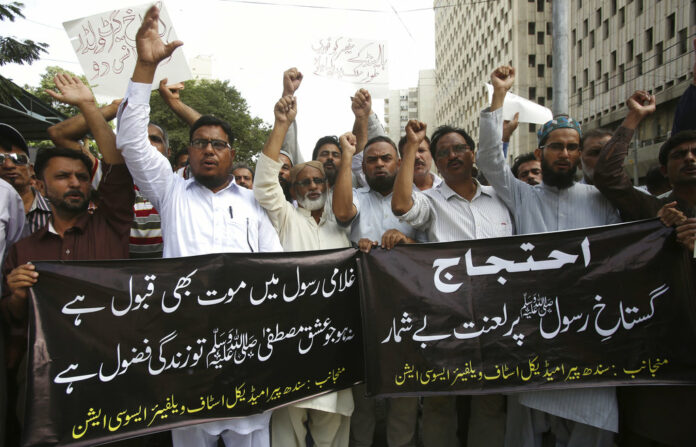 Pakistani protesters shout slogans Wednesday during a protest against the planned anti-Islam cartoon competitions, in Karachi, Pakistan. Photo: Fareed Khan / Associated Press