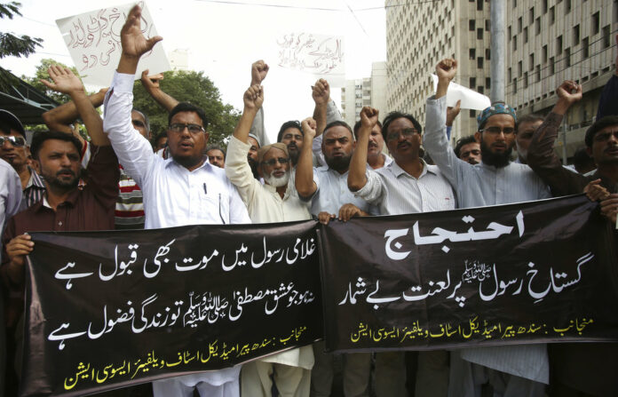 Pakistani protesters shout slogans Wednesday during a protest against the planned anti-Islam cartoon competitions, in Karachi, Pakistan. Photo: Fareed Khan / Associated Press Pakistani protesters shout slogans Wednesday during a protest against the planned anti-Islam cartoon competitions, in Karachi, Pakistan. Photo: Fareed Khan / Associated Press