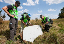 Australian Lawmaker Says MH17 Was Her Most Emotional Time Dutch and Australian police officers investigate the Malaysian Airlines flight MH-17 crash site in 2014 in Ukraine. Photo: Ministerie van Defensie / Associated Press