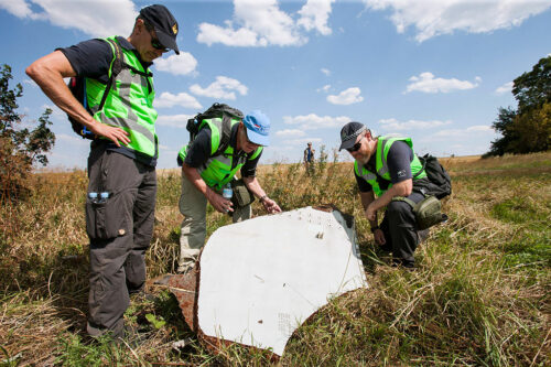 Dutch and Australian police officers investigate the Malaysian Airlines flight MH-17 crash site in 2014 in Ukraine. Photo: Ministerie van Defensie / Associated Press
