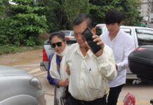 Police Implicate Actor’s Parents in Bilking Finn of ‘Bitcoin’ Jiratpisit Jaravijit, at right, with his father Suwit Jaravijit and mother Lertchatkamol Jaravijit on Monday at the Crime Suppression Division in Bangkok.