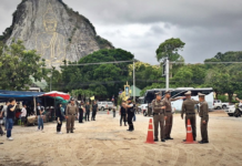 Cambodia to Hand Over Phuket Club Owner Wanted For Murder Police inspect the crime scene July 29 in front of the Buddha Mountain in Chonburi province.