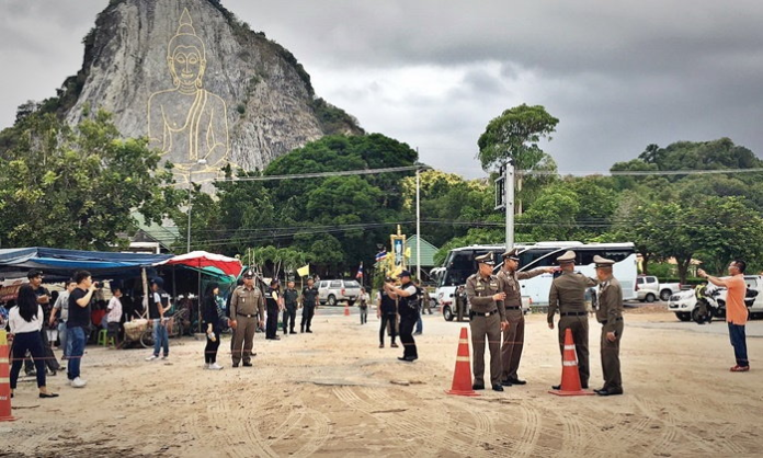 Police inspect the crime scene July 29 in front of the Buddha Mountain in Chonburi province. Police inspect the crime scene July 29 in front of the Buddha Mountain in Chonburi province.