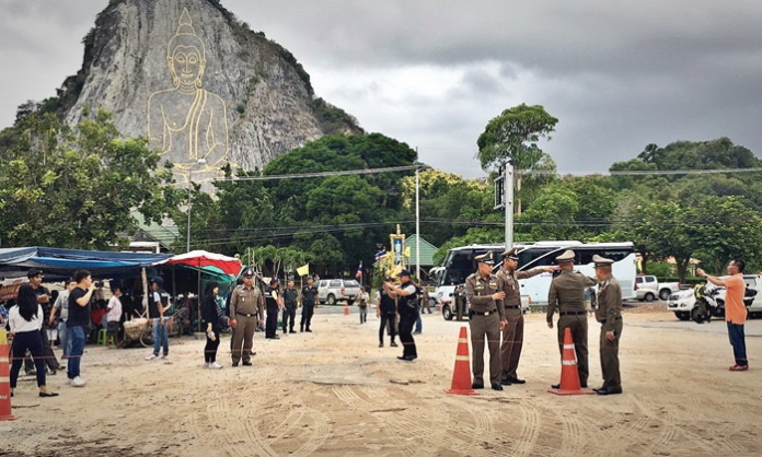 Police inspect the crime scene July 29 in front of the Buddha Mountain in Chonburi province.