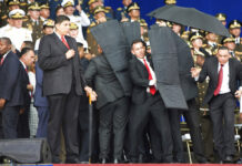 Venezuelan President Escapes Exploding Drone Assassins Security personnel surround Venezuela's President Nicolas Maduro during an incident as he was giving a speech Saturday in Caracas. Photo: Xinhua via AP