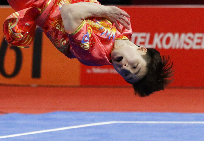 South Korea's Lee Ha Sung flips during the Wushu men's Changquan games at the 18th Asian Games on Sunday in Jakarta. Photo: Aaron Favila / Associated Press South Korea's Lee Ha Sung flips during the Wushu men's Changquan games at the 18th Asian Games on Sunday in Jakarta. Photo: Aaron Favila / Associated Press