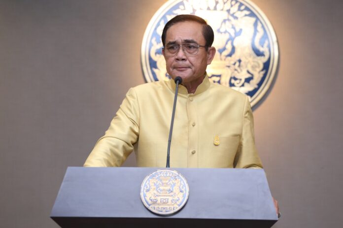 Gen. Prayuth Chan-ocha speaks to reporters Tuesday at Government House.
