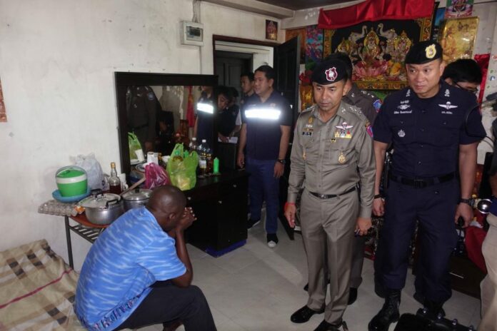 Maj. Gen. Surachet Hakpan, second from right, inspects a room during the 13th