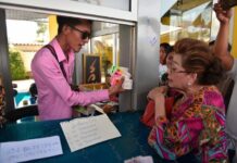 Police Seek Lotto Seller Over Fake 90M Baht Winning Tickets A photo of Thanawat “Pete” Kumhaengpol, left.