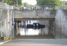 Housing Developer, Guards Charged Over Underpass Drowning A pickup truck is submerged Sep. 6 in a Bangkok underpass where its driver drowned the night before.