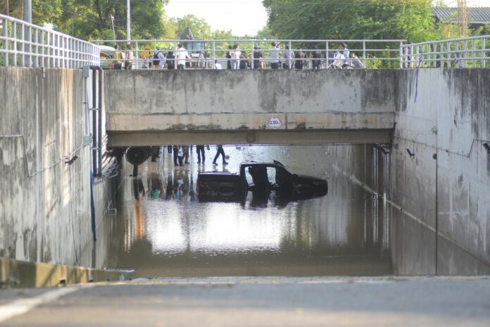 A pickup truck is submerged Sep. 6 in a Bangkok underpass where its driver drowned the night before.