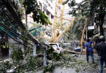 At Least 3 Injured When Crane Collapses in Silom A crane collapsed on a car, trees and electric poles Friday morning in Saladaeng Road.