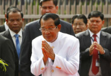 Cambodian Lawmakers Pass Measure to Ease Political Ban Cambodia's Prime Minister Hun Sen, center, sees King Norodom Sihamoni off in September in front of the National Assembly in Phnom Penh, Cambodia. Photo: Heng Sinith / Associated Press