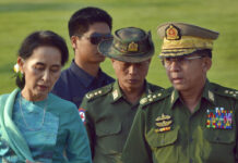 World Criticism Doesn’t Have Suu Kyi or Myanmar on the Ropes Aung San Suu Kyi, Myanmar's foreign minister and de facto leader, left walks in 2016 with senior General Min Aung Hlaing, Myanmar's commander-in-chief, right, in Naypyitaw, Myanmar. Photo: Aung Shine Oo / Associated Press