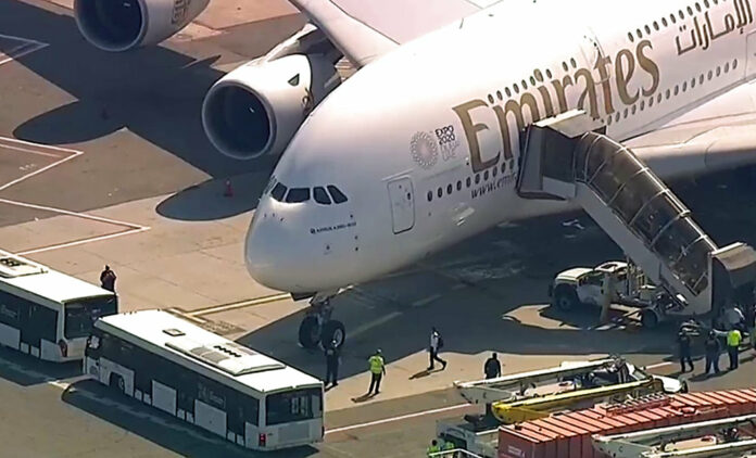 In this frame from video, a person walks off an Emirates plane at JFK International Airport to a waiting bus on Wednesday, Sept. 5, 2018, in New York. Image: Associated Press