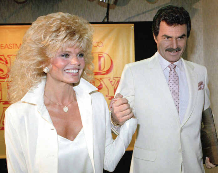 Burt Reynolds, right, holds hands with Loni Anderson at luncheon in in 1987 in Los Angeles. Photo: Bob Galbraith / Associated Press Burt Reynolds, right, holds hands with Loni Anderson at luncheon in in 1987 in Los Angeles. Photo: Bob Galbraith / Associated Press