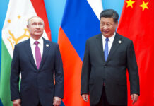 Russia Launches Biggest Ever War Games Involving China In this Sunday, June 10, 2018 file photo, Chinese President Xi Jinping, right, and Russian President Vladimir Putin pose for a photo at the Shanghai Cooperation Organization (SCO) Summit in Qingdao in eastern China's Shandong Province. Photo: Alexander Zemlianichenko / Associated Press