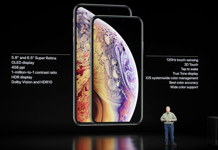 Phil Schiller, Apple's senior vice president of worldwide marketing, speaks about the Apple iPhone XS and Apple iPhone XS Max at the Steve Jobs Theater during an event to announce new Apple products Wednesday, Sept. 12, 2018, in Cupertino, California. Photo: Marcio Jose Sanchez / Associated Press