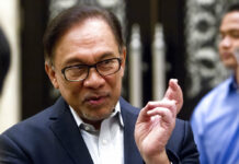 Malaysian PM-in-Waiting Anwar Takes Oath as Lawmaker Malaysian politician Anwar Ibrahim speaks before a court hearing at Federal Court in September in Putrajaya, Malaysia. Photo: Yam G-Jun / Associated Press