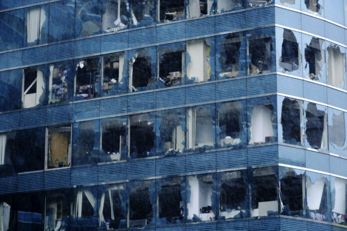 In this Sunday, Sept. 16, 2018, photo released by Xinhua News Agency, an office building's windows damaged by Typhoon Mangkhut in Hong Kong. Photo: Wang Shen / Associated Press