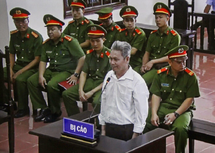 In this Wednesday, Sept. 19, 2018, photo, activist Dao Quang Thuc stands trial in Hoa Binh, Vietnam. Photo: Vu Thi Ha / Associated Press
