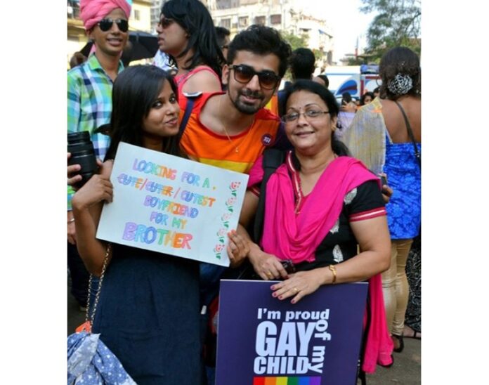 Indian actor Nakshatra Bagwe, center, with his mother Swati, left, and sister Samiksh Mirashi at an LGBT Pride march in 2015 in Mumbai, India. Photo: IndianGlamor / Wikimedia Commons