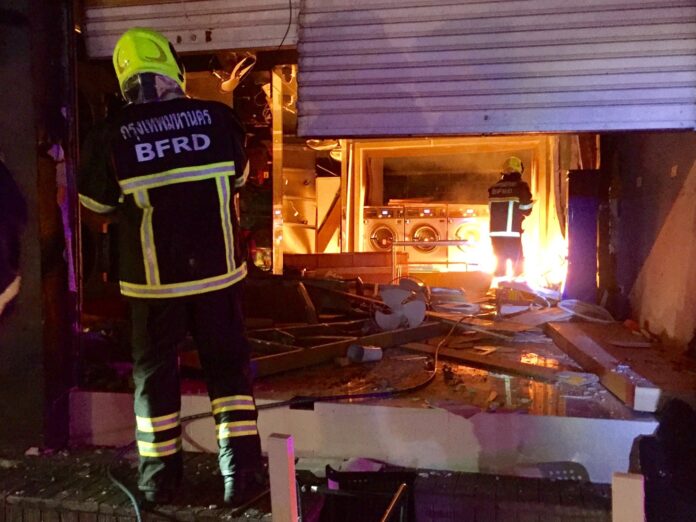 Firefighters at the scene of an explosion Monday morning in a laundromat in Bangkok’s Din Daeng district. Firefighters at the scene of an explosion Monday morning in a laundromat in Bangkok’s Din Daeng district.