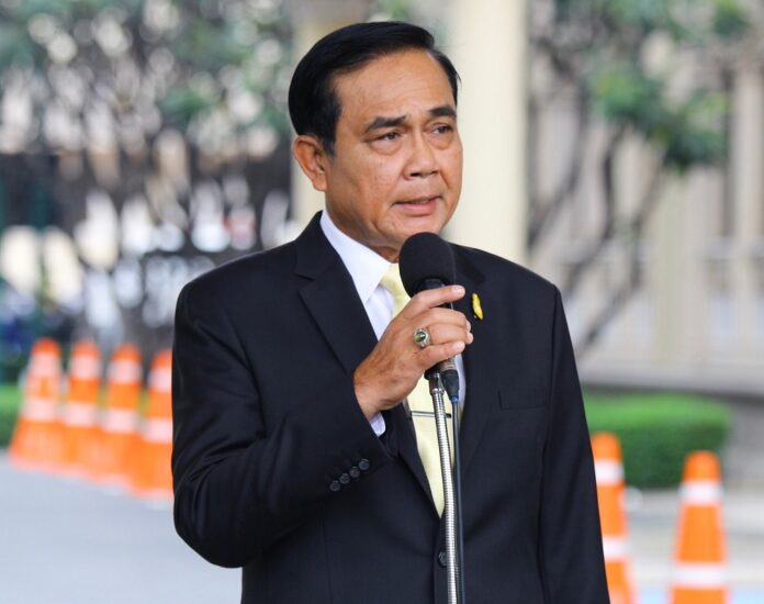 Junta chairman Prayuth Chan-ocha speaks to reporters Monday