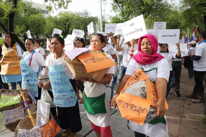 Sellers take to the streets to take back the streets for vending Tuesday at the Government House in Bangkok.