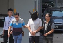 Doctor Gets Life Term in Hong Kong Over Yoga Ball Killings An undated image of Khaw Kim-sun, center, in Hong Kong. Image: The Star Online / YouTube