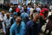 Maldives Election Begins Amid Cries of Unfairness Maldivians queue at a polling station during presidential election day in Male, Maldives, Sunday. Photo: Eranga Jayawardena / Associated Press