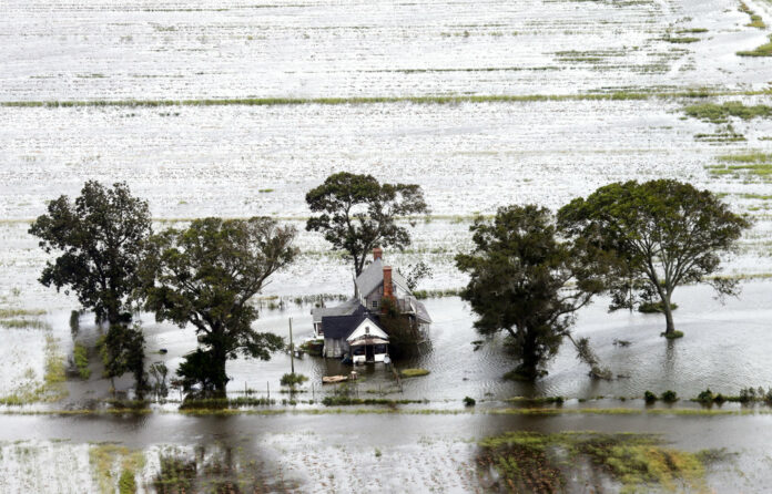 A farm house is surrounded by flooded fields from tropical storm Florence on Saturday in Hyde County, North Carolina. Photo: Steve Helber / Associated Press A farm house is surrounded by flooded fields from tropical storm Florence on Saturday in Hyde County, North Carolina. Photo: Steve Helber / Associated Press