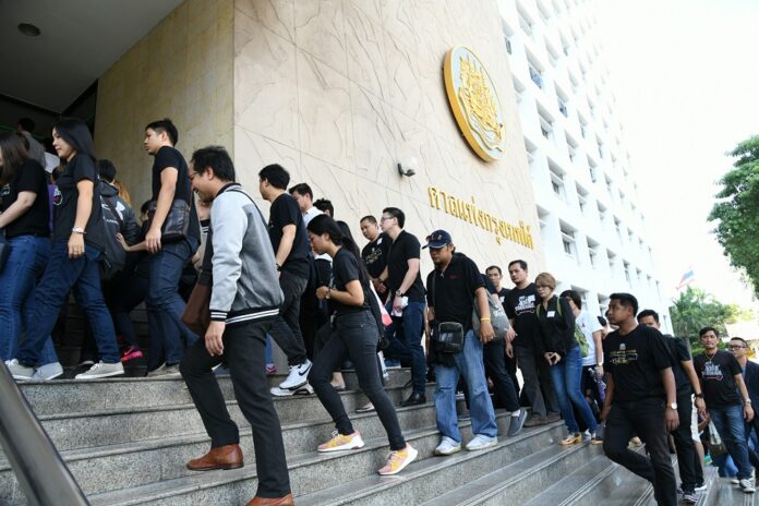 Hundreds of plaintiffs arrive at a Bangkok civil court Friday to hear the verdict.