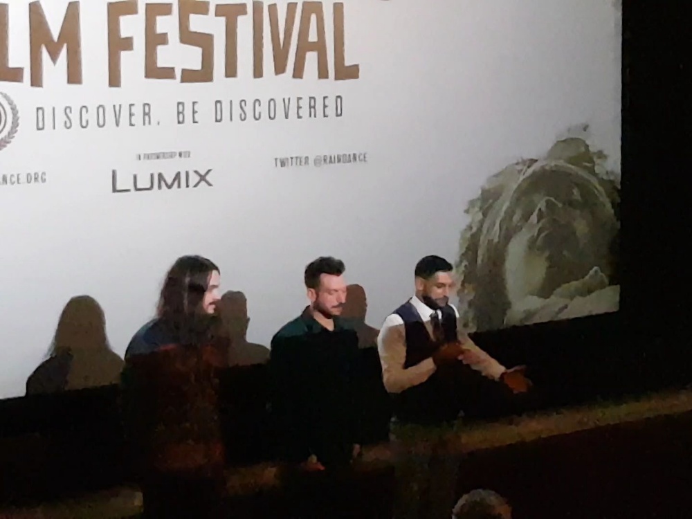 From left: Oliver Clark, Blair MacDonald and Amir Khan speak Saturday following the screening of "Team Khan" at the Raindance Film Festival in London, England.