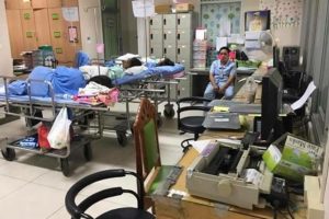 Patients lie on beds in what appears to be a staff office. Photo: Thiravat Hemachudha / Facebook