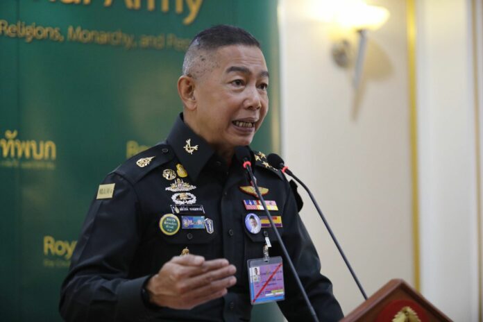 Army chief Gen. Apirat Kongsompong speaks to reporters Wednesday in Bangkok.