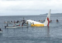 Passenger’s Body Found in Pacific Lagoon After Plane Crash Local fishing boats move in to recover the passengers and crew of an Air Niugini flight Friday following the plane crashing into the sea on its approach to Chuuk International Airport in the Federated States of Micronesia. Photo: James Yaingeluo / Associated Press