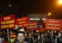 Macedonia: Referendum Approves Name Change, but Turnout Low Supporters of a movement for voters to boycott the referendum, hold placards Sunday as they celebrate in central Skopje, Macedonia, after election officials gave low turnout figures. Photo: Thanassis Stavrakis / Associated Press