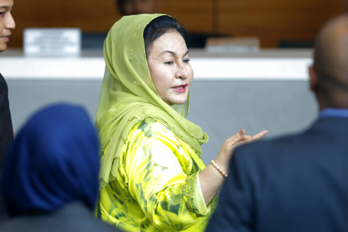 Rosmah Mansor, wife of Malaysian Prime Minister Najib Razak, arrives at the Anti-Corruption Agency for questioning Wednesday in Putrajaya, Malaysia. Photo: Vincent Thian / Associated Press