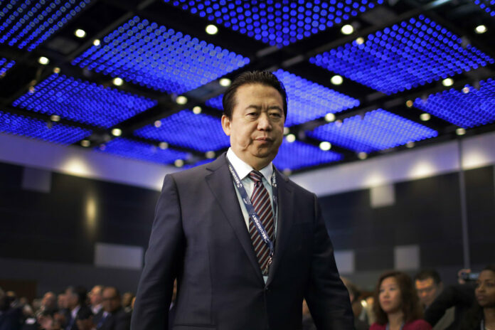 Interpol President, Meng Hongwei, walks toward the stage to deliver his opening address in 2017 at the Interpol World congress in Singapore. Photo: Wong Maye-E / Associated Press