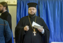 Romania: Weak Voter Turnout Voids Gay Marriage Referendum A priest exits a voting booth Saturday in Bucharest, Romania. Photo: Andreea Alexandru / Associated Press