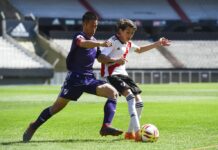‘Wild Boars’ Play Friendly Match in Argentina Kapol Jantawong, coach and captain of Thai team Wild Boars, left, fights for the ball Sunday during a friendly soccer match against River Plate Youth Team at Monumental stadium in Buenos Aires, Argentina. Photo: Eitan Abramovich / Associated Press