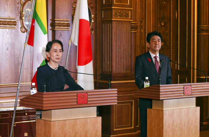 Myanmar's leader Aung San Suu Kyi delivers her speech beside Japanese Prime Minister Shinzo Abe during their joint press remarks following their bilateral meeting at the Akasaka Palace state guest house Tuesday in Tokyo. Photo: Toshifumi Kitamura / Associated Press