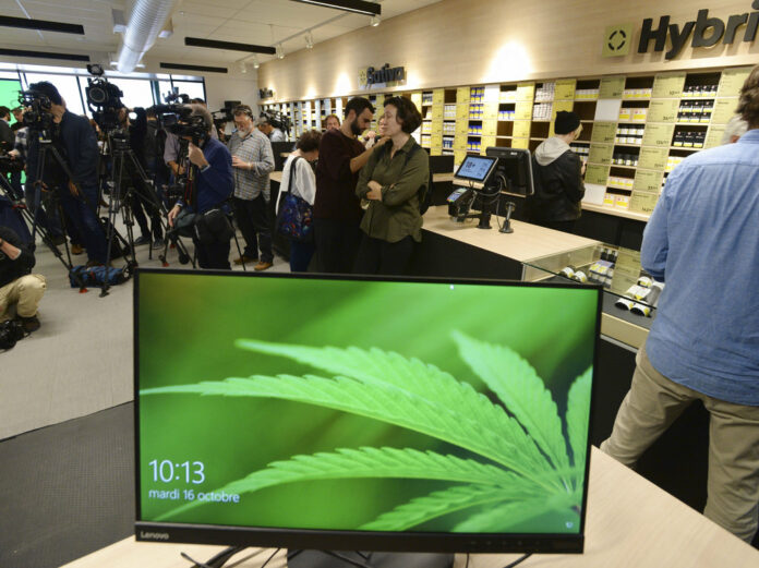 Members of the media attend a Tuesday preview for one of Quebec's new cannabis stores in Montreal, Canada. Photo: Ryan Remiorz / Associated Press