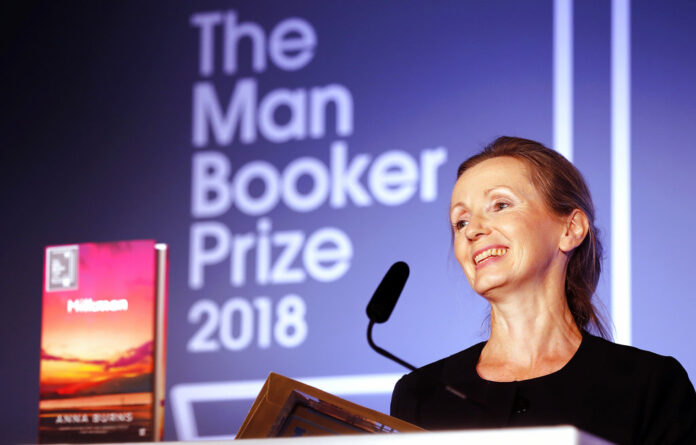 Writer Anna Burns smiles Tuesday after she was presented with the Man Booker Prize for Fiction 2018 by Britain's Camilla, the Duchess of Cornwall during the prize's 50th year at the Guildhall in London. Photo: Frank Augstein / Associated Press