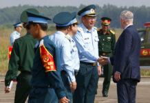US Defense Secretary Sees the Enduring Costs of Vietnam War U.S. Secretary of Defense Jim Mattis, right, shakes hands with Vietnam's Air Force Deputy Commander Gen. Bui Anh Chung as he visits Bien Hoa airbase, where the U.S. army stored the defoliant Agent Orange during the Vietnam War, in Bien Hoa city, Wednesday outside Ho Chi Minh city, Vietnam. Photo: Associated Press
