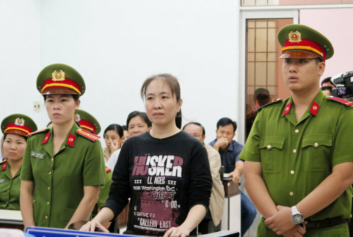 Nguyen Ngoc Nhu Quynh, center, a prominent Vietnamese blogger, stands trial in 2017 in the south-central province of Khanh Hoa, Vietnam. Photo: Tien Minh / Associated Press